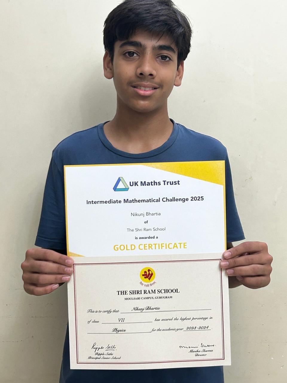 Nikunj holding certificates