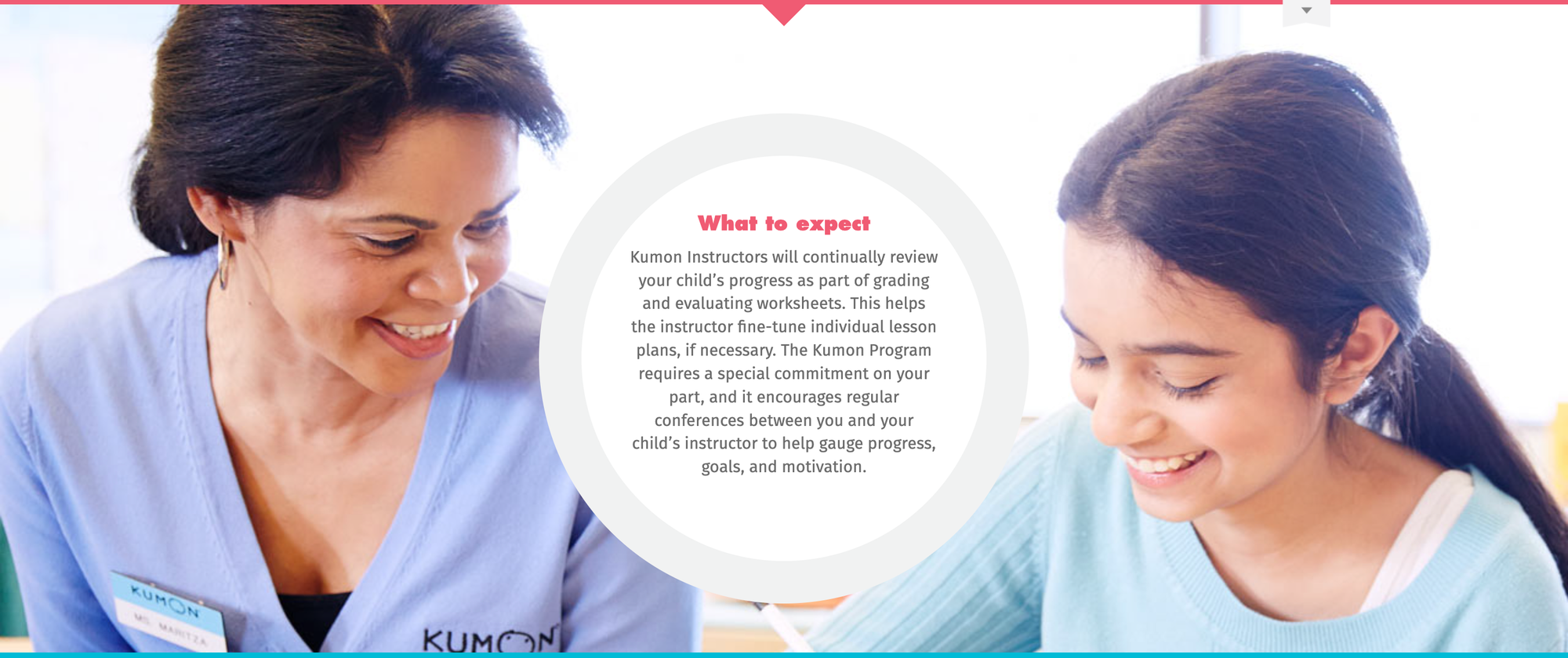 Kumon instructor reviewing worksheets with a student at the center