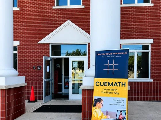 A Cuemath event banner outside the venue.