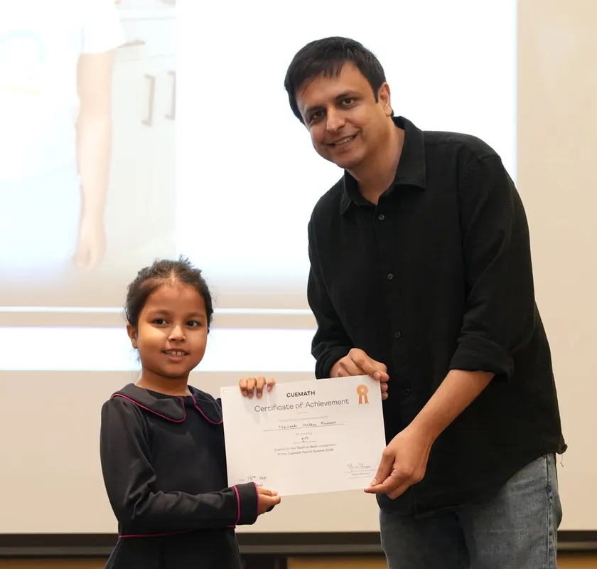 Nevaeh Halder Kumar receiving the Teach-It-Back first prize certificate